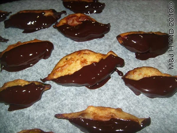 spain perleta home kitchen recipe valentines day treat dry battered chocolate-coated orange-leaves on grease-proof paper