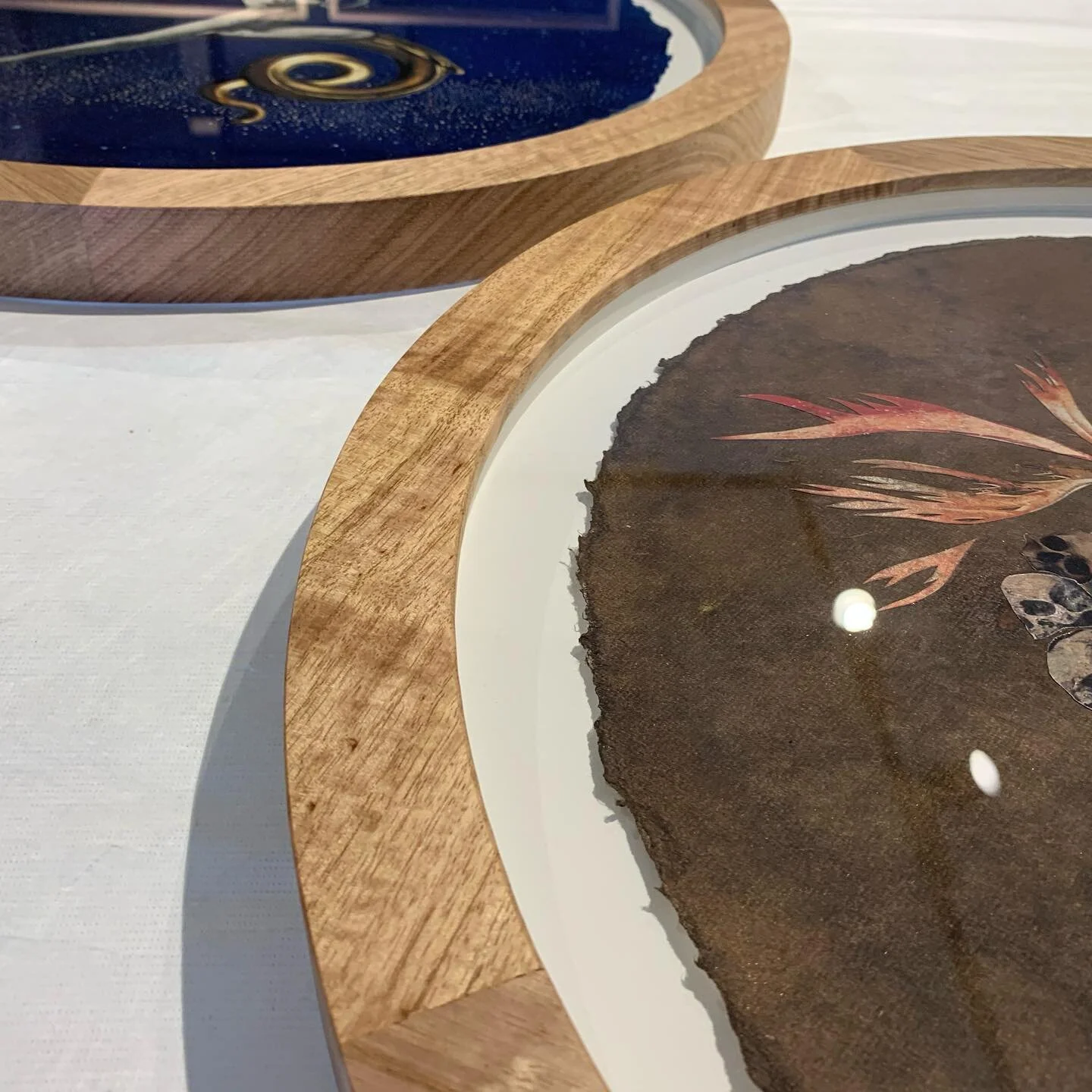 A selection of circle frames made by us. We can make frames up to 1200mm diameter in house on our CNC from hardwood or board. #circleframes #fineartframing