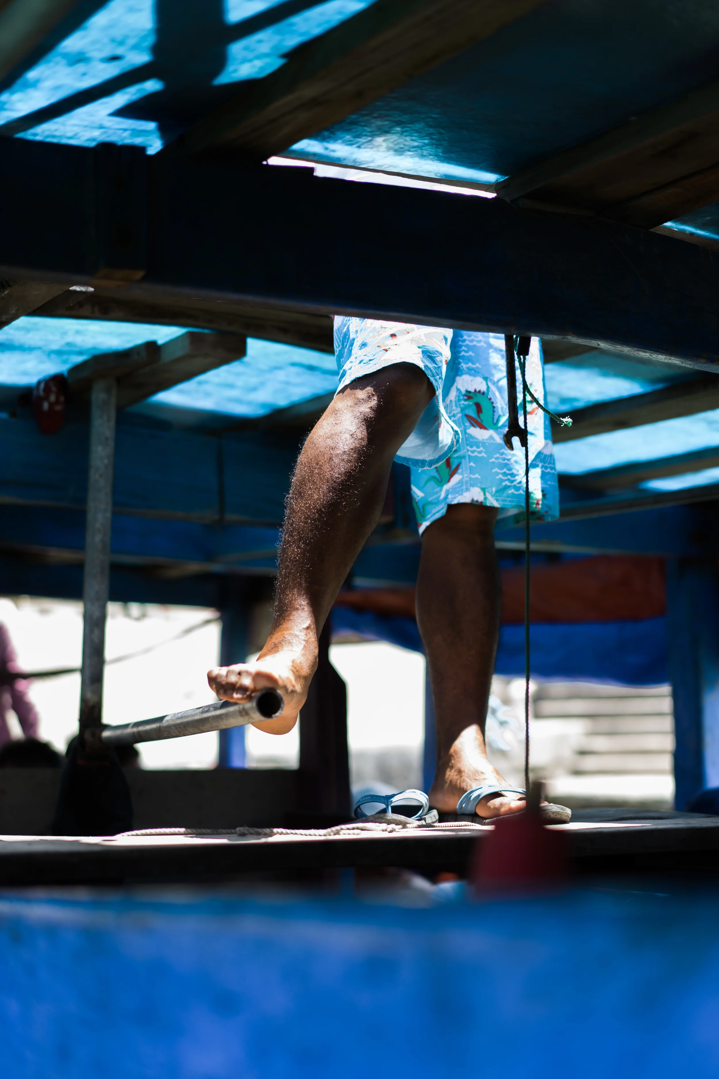 Our boat driver uses his foot to steer the boat. Pro.