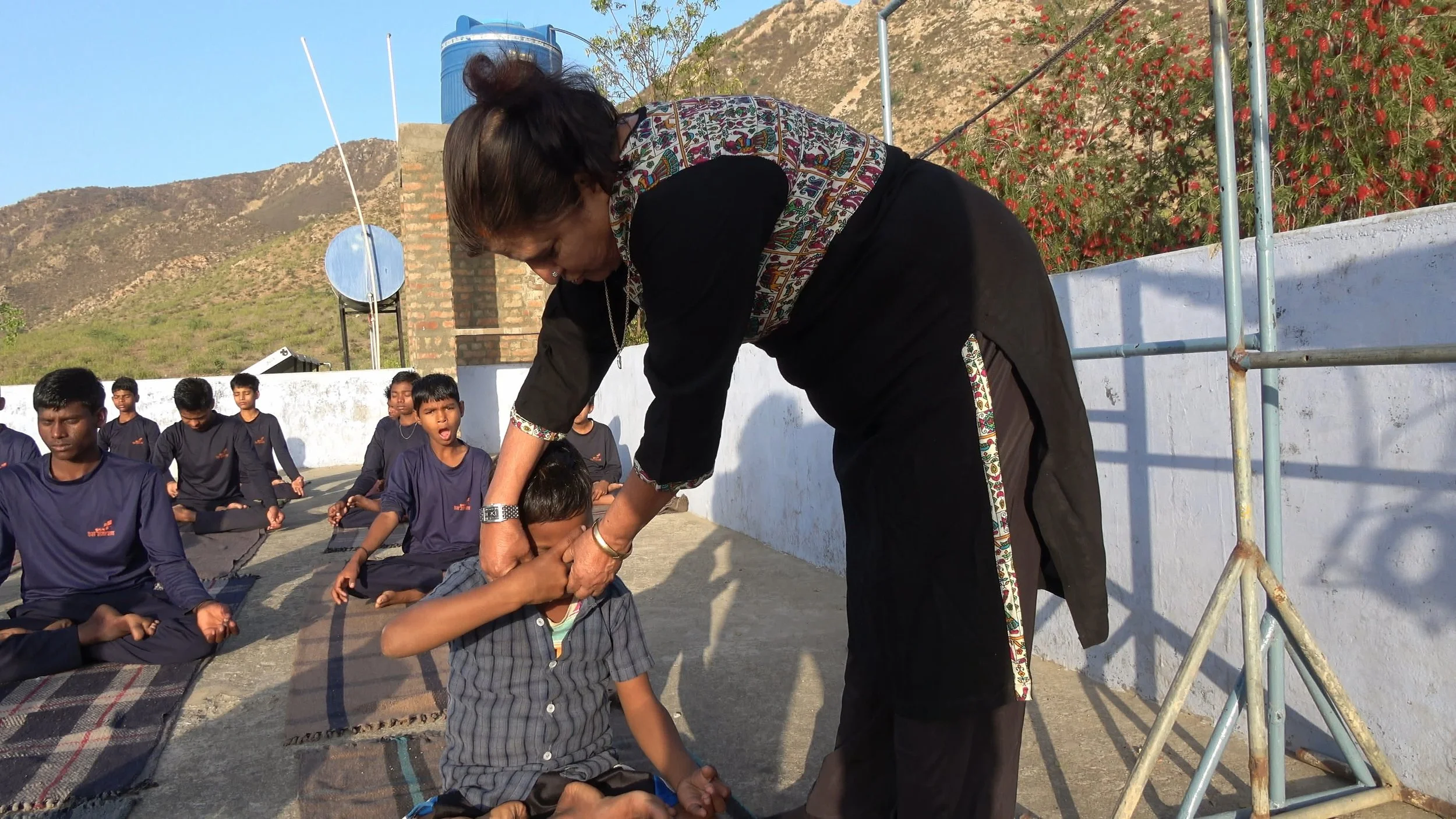 Sumedha adjusts Noman's position 