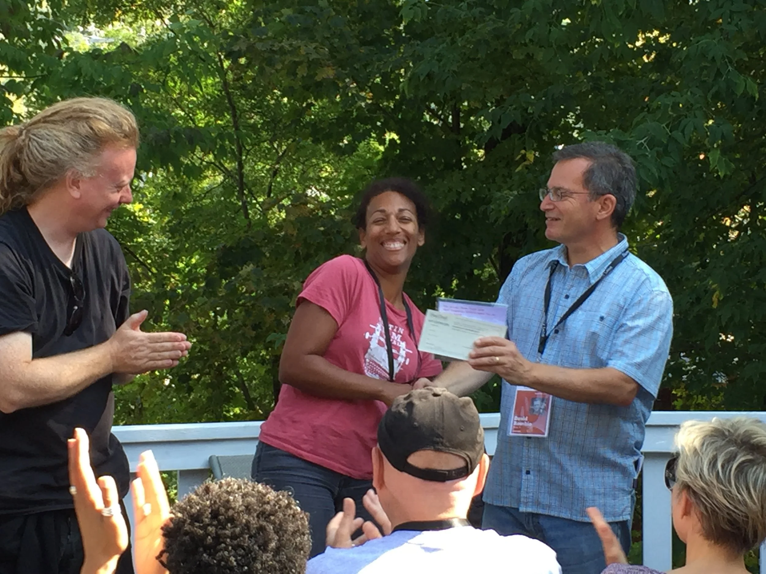 Melody Cooper being awarded Stowe Story Labs / Tangerine Entertainment Fellowship, Fall 2017, with Stowe Story Labs Founders David Pope and David Rocchio