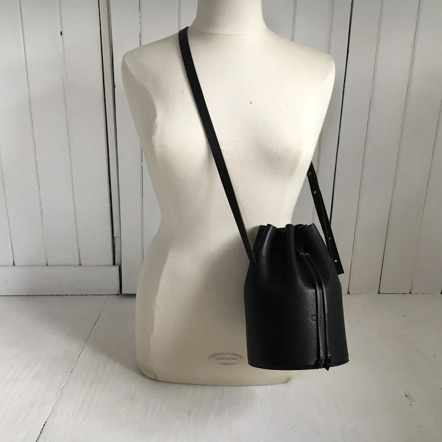 Black leather crossbody bucket bag by CARV made in London