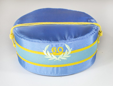The light blue cap denotes that the wearer has been a Scottish Rite Mason for 50 years or longer, a true distinction in our fraternity!