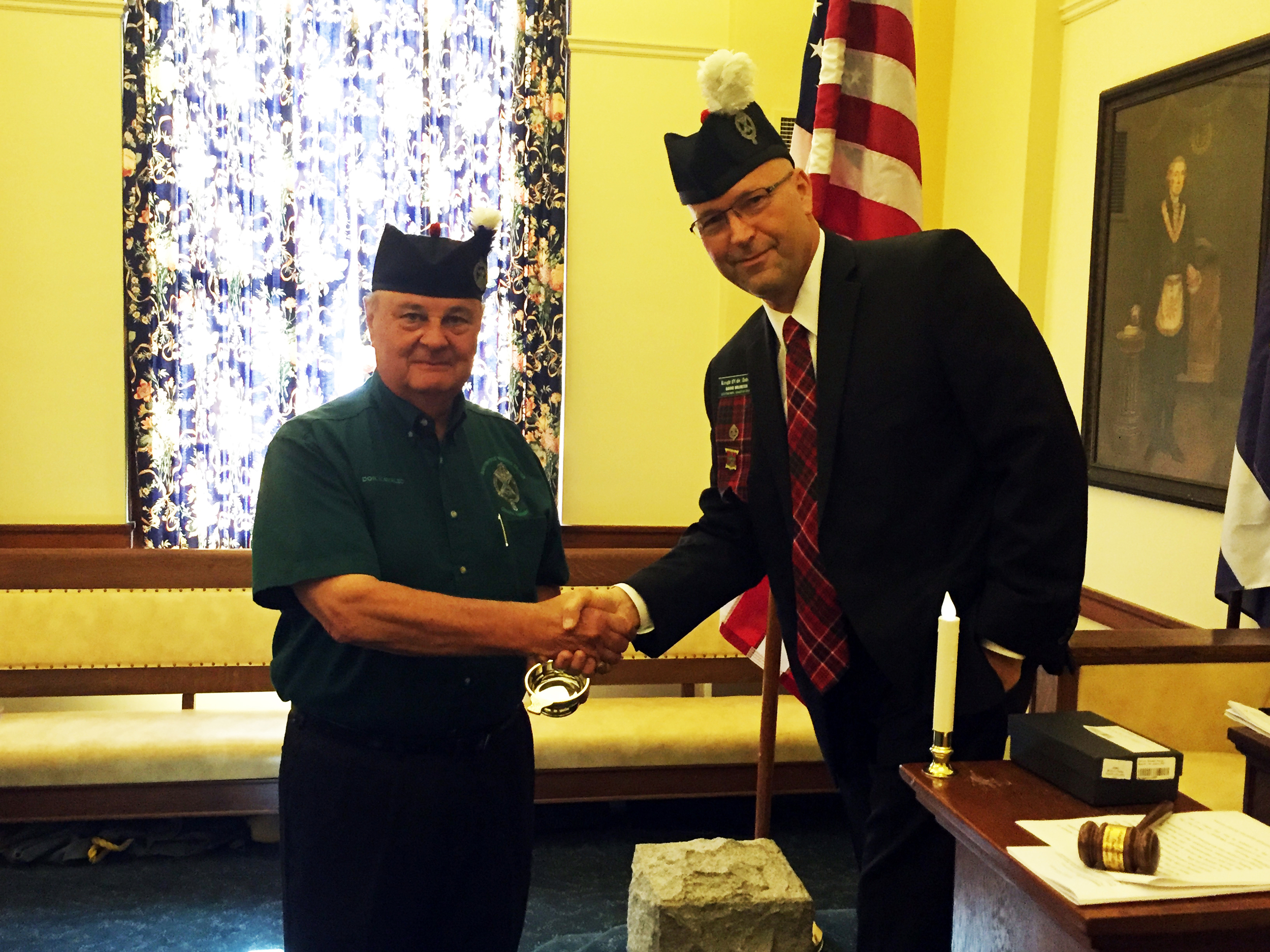 David Meinzer, 32°, Venerable Master of the Knights of St. Andrew, presents past Venerable Master Don Kavalec, 32° KCCH with a pewter Scottish quaich in recognition for his services.