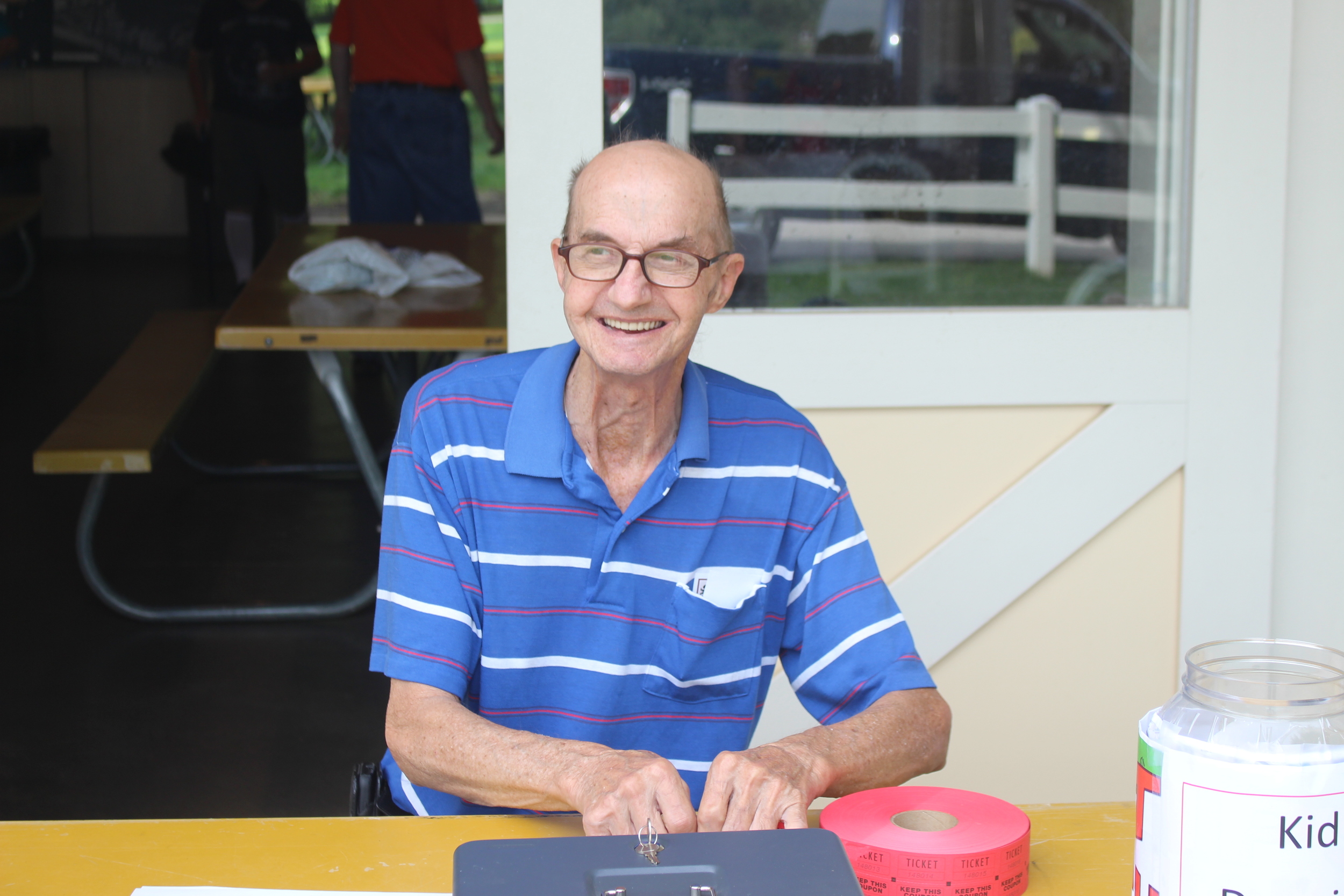 John Chester mans the check-in table