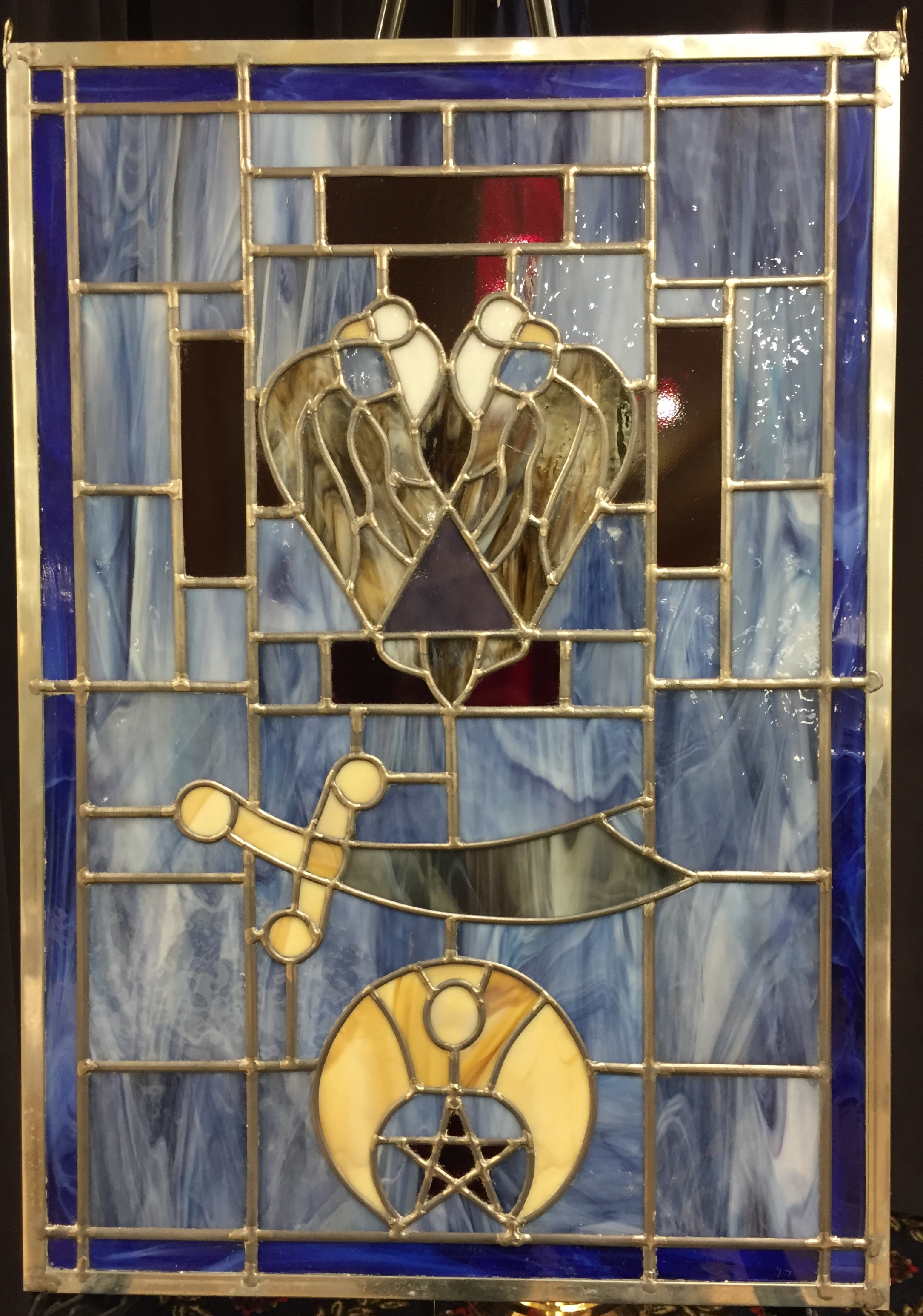 Beautiful stained glass window made by Scott Oglesby, 33° in honor of Jerome Given, 33° and reflecting his lifelong, active Scottish Rite and Shrine membership.