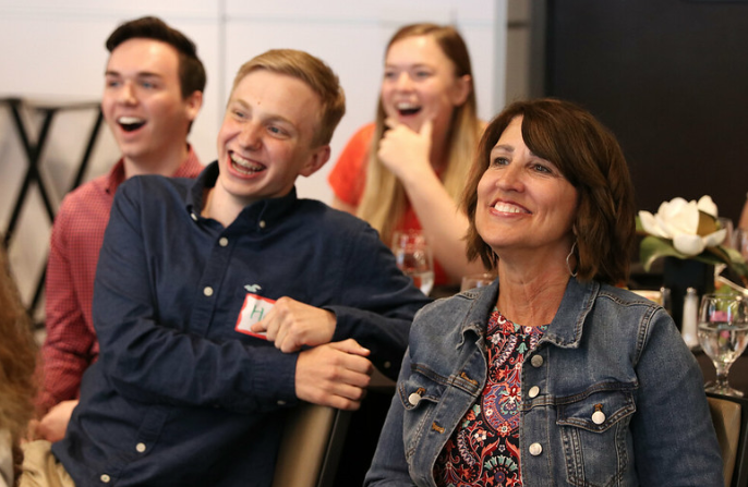 Anita Padgett, adviser of The Verve, and staff members react to the announcement of The VerveCast’s superior rating in the General Excellence contest.