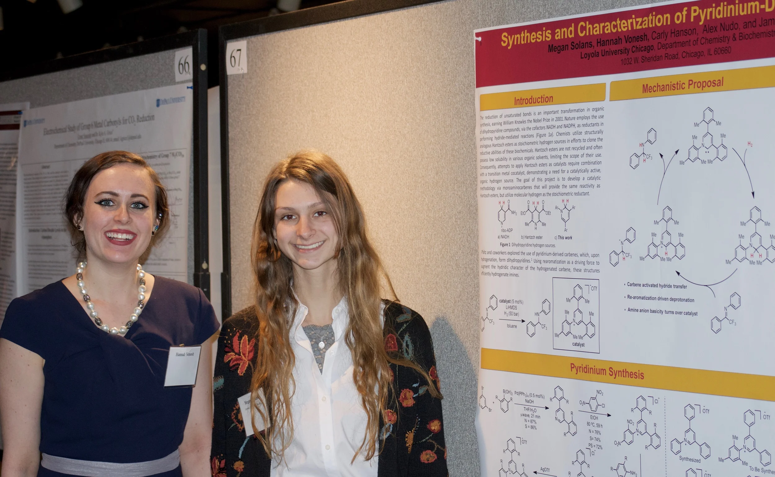 Hannah and Megan in front of their poster