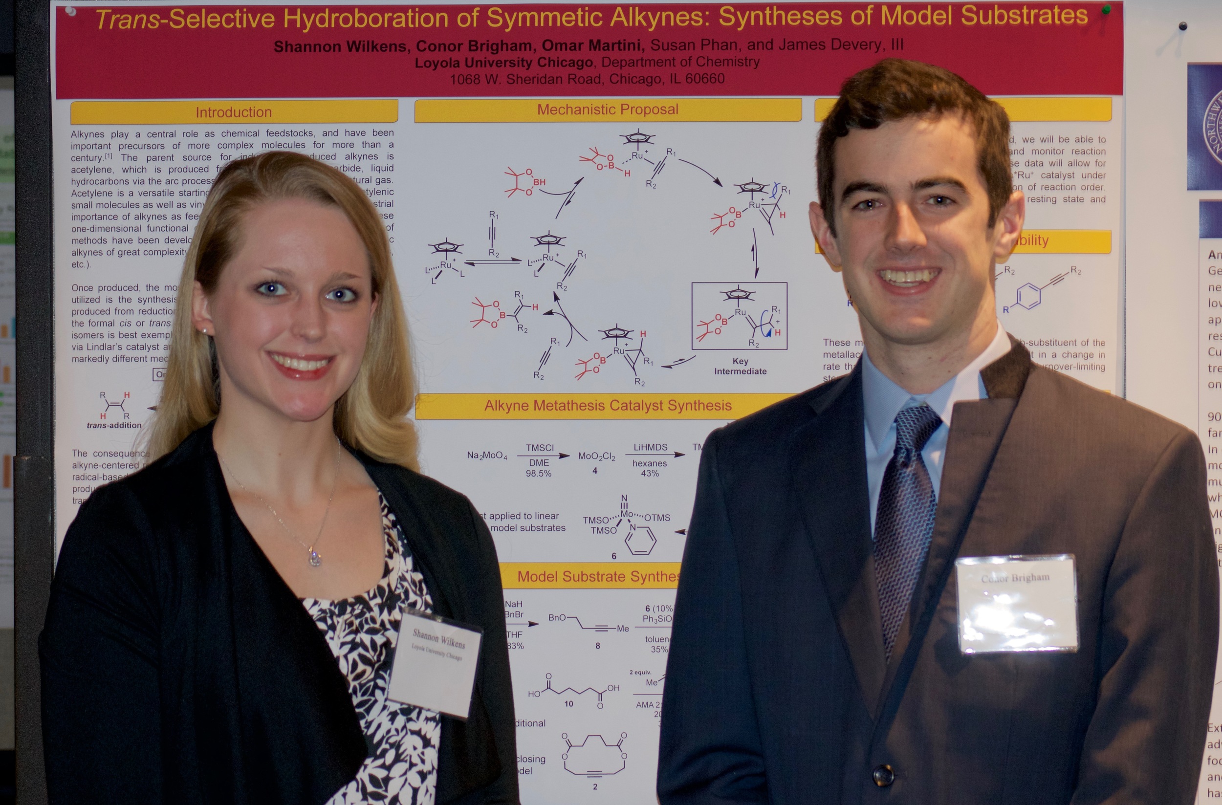 Shannon and Conor in front of their poster