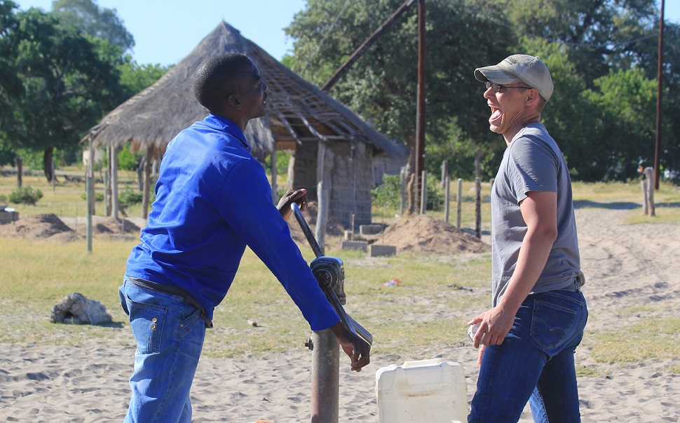 Pro and Flo having a laugh by the village water pump