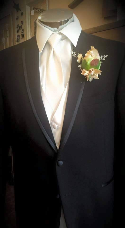 The Jherret Boutonniere is made from hand dyed and painted silk Peony bulb, single Swarovski Crystal, single antique pearl, tea-stained and hand painted Hydrangeaa Petals, mixed sprigs and rhinestone pin!