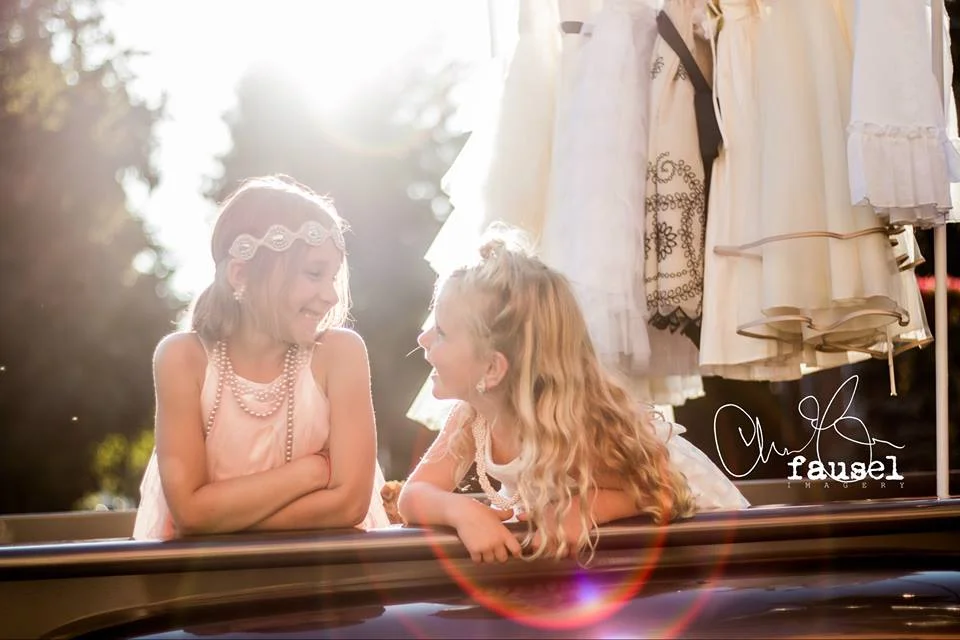 The giggling girlies! In front of Bridal Barn, in the back of Grandpa's vintage GMC turned into a mobile dress boutique for little ladies to dress up like a Princess!