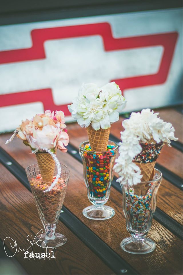 Gee June head piece's atop ice cream cones in the back of an antique Chevy!