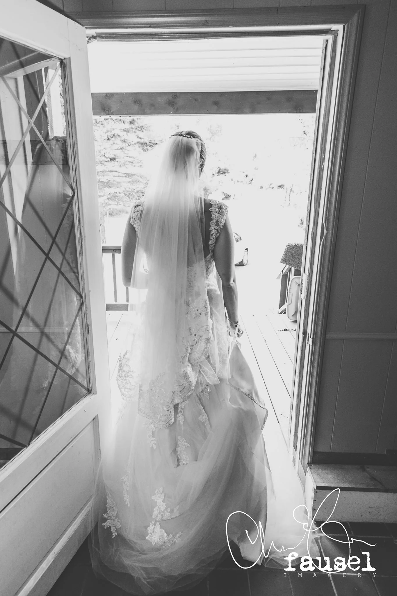 From the back the veil hit perfectly to her dresses trumpet bottom tier!