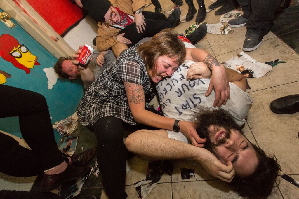 Edan Wilbur surrounded by friends and shredded VICE magazines shortly after the final show. 