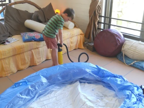 My older son helping to pump up the pool