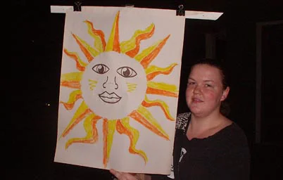 Woman holding Sun banner