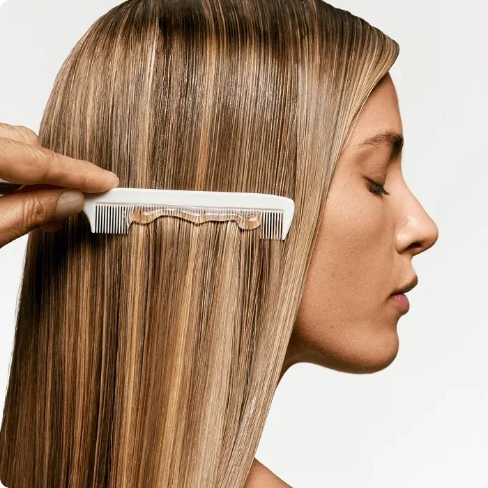 2025-loreal-professional-products-biolage-brand-woman-with-gel-and-comb-in-her-hair-hair-spa.webp