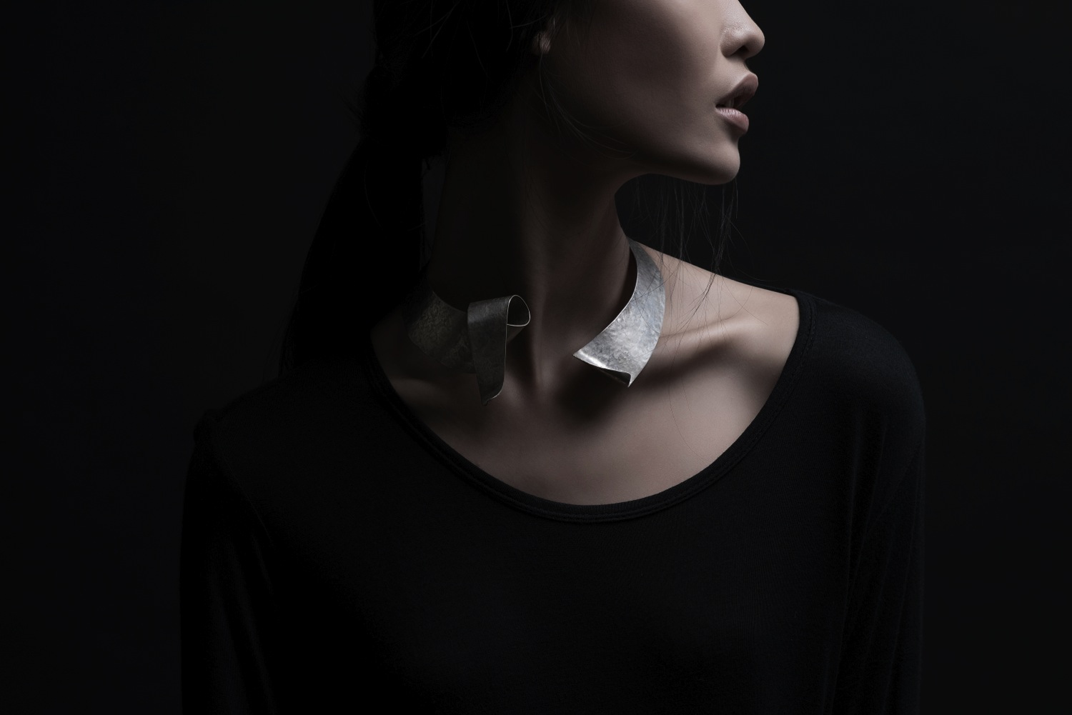 embracing fluidity as the collection's forte, and thus capturing fluid movements as its basic forms.