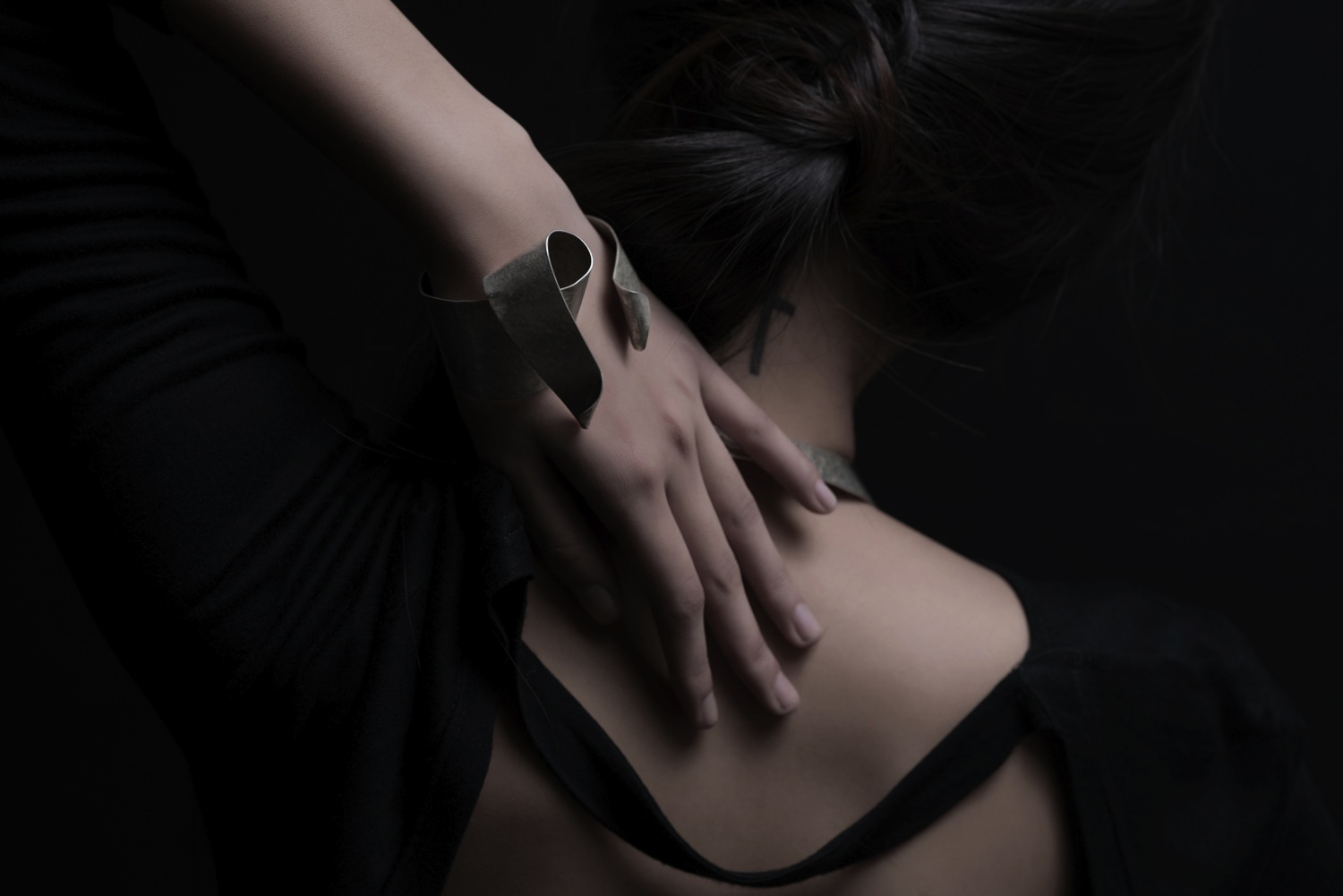 using silver-plated textured brass and cold-working process to preserve the fluid and dynamic motions.