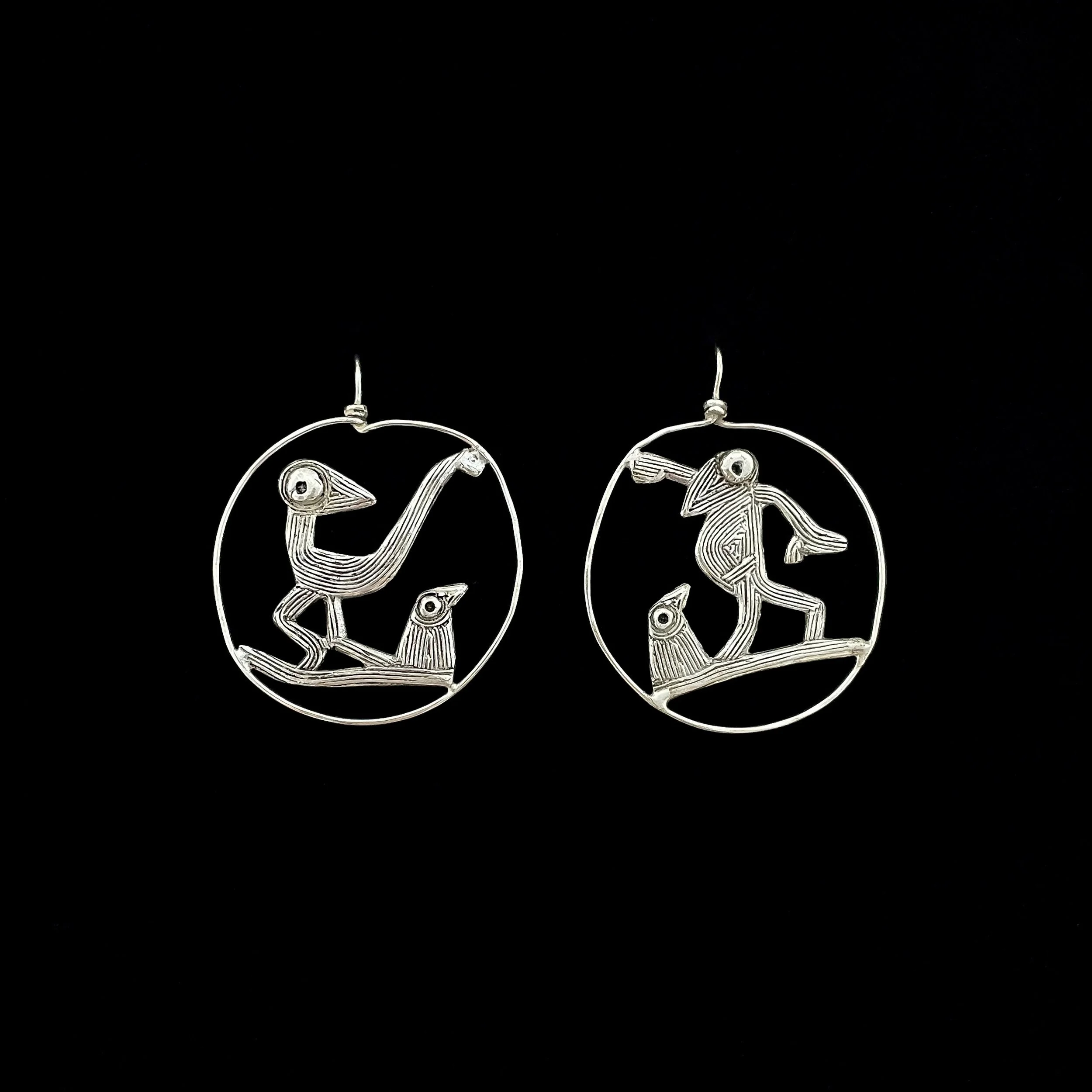 Farandole dancing birds earrings by Elisabeth Riveiro in silver-plated bronze, circular sculptural design featuring stylised bird figures, handcrafted using lost-wax casting