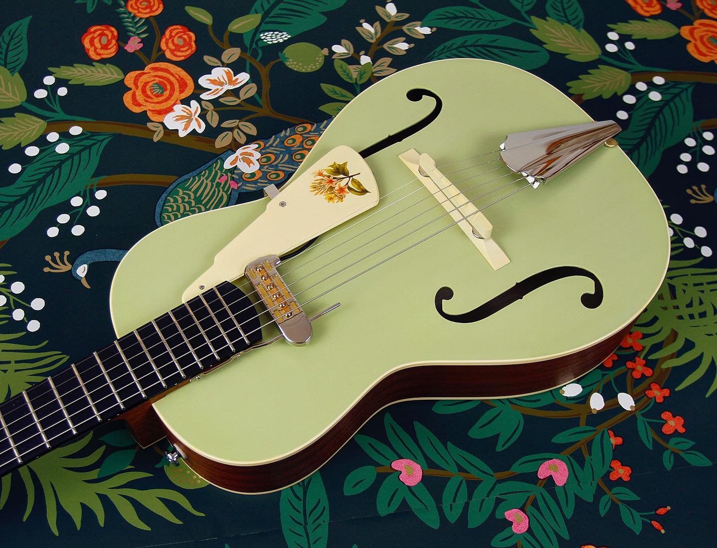 A few more shots of this latest Rosetta Model 2 in faded mist green. This is a spruce and sapele guitar with an adjustable mahogany neck and ebony fingerboard combo. The instrument also features some classic Ivoroid accents (binding, pickguard and he