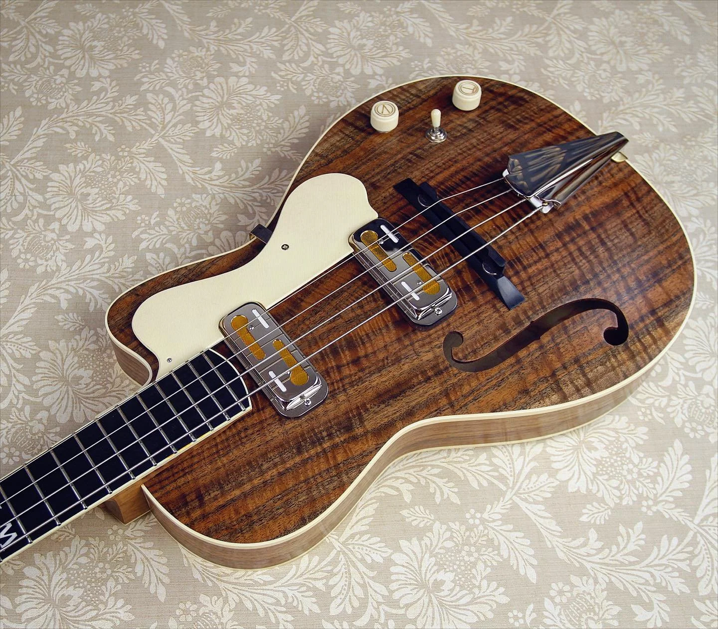 Two final reclining shots of the latest short scale Rosetta archtop bass. This is a lightweight, 30&rdquo; scale, parlor sized instrument featuring the standard Rosetta adjustable neck system. Other features include: figured walnut body, roasted mapl