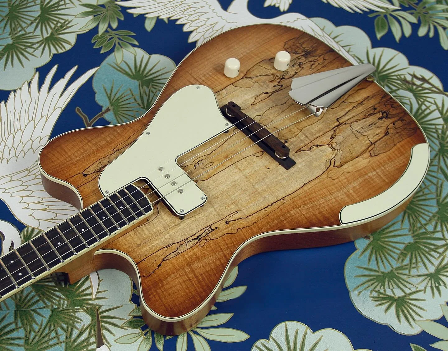 This tenor electric guitar has been in the works for quite a while and I&rsquo;m thrilled to finally see it leave the nest! 

This is a 22.75&rdquo; scale instrument, tuned in fifths (GDAE) and features a beautiful spalted maple top, laminated onto a