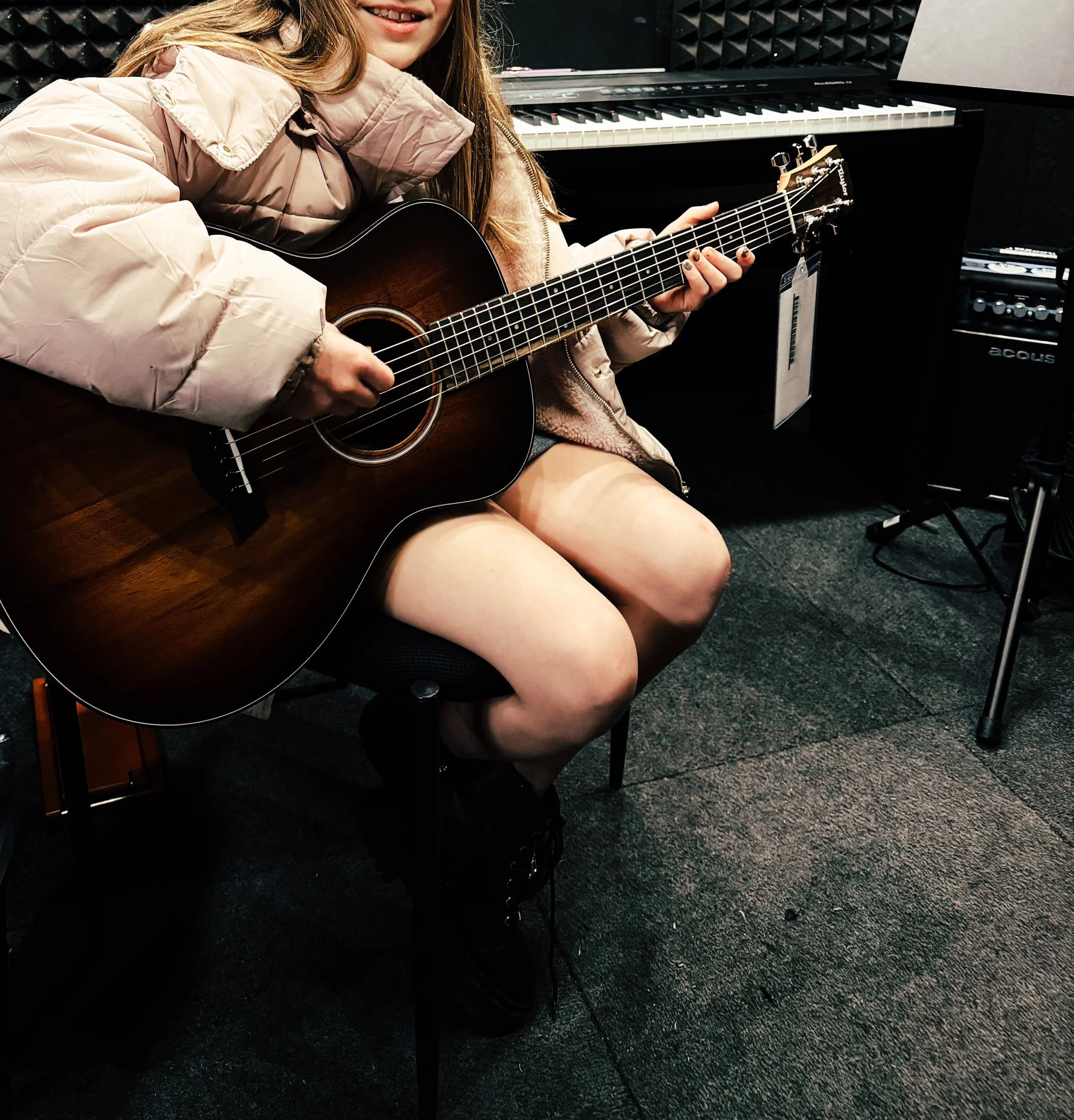 Learning to play the guitar for kids. Acoustic guitar for kids.