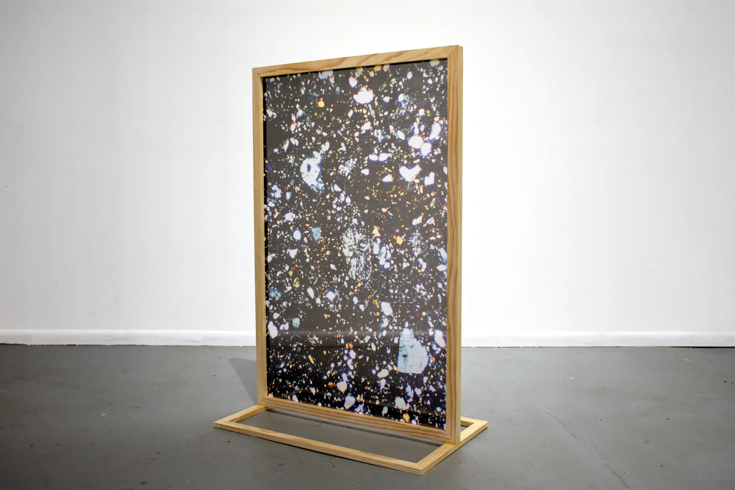 Stand and Slide , 2018 Moon breccia thin sections viewed through polarized light, digitally printed on silk chiffon, free-standing wood frame