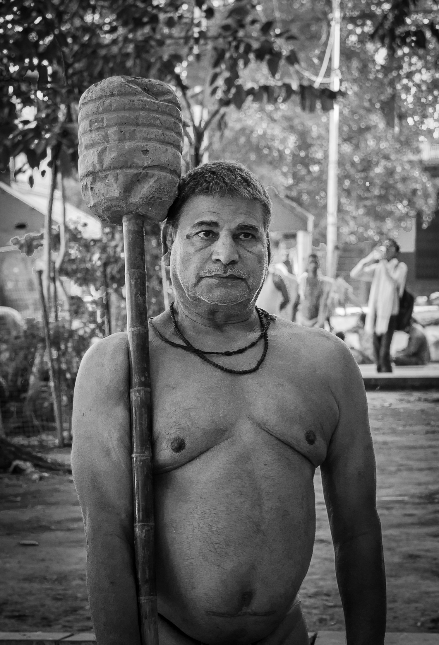 © Ayash Basu. Meanwhile, after completing his mace exercises, Nandu Yadav positions it carefully on his way to the akhara, casting his eye on the rest and voicing out instructions about correct posture and exercise technique. "Kushti is all about agility ("lachak"), strength alone is not enough," he says, watching another wrestler do sit ups and rope jumps. He can't do either as his knees have fallen prey to 30 years of wrestling in the akhara.