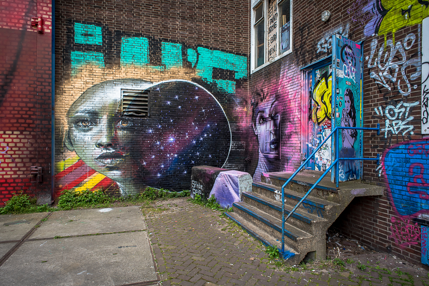 © Ayash Basu. High quality, colorful graffiti grace many an old brick facade, changing weekly and constantly renewing the artistic fabric of the NDSM.