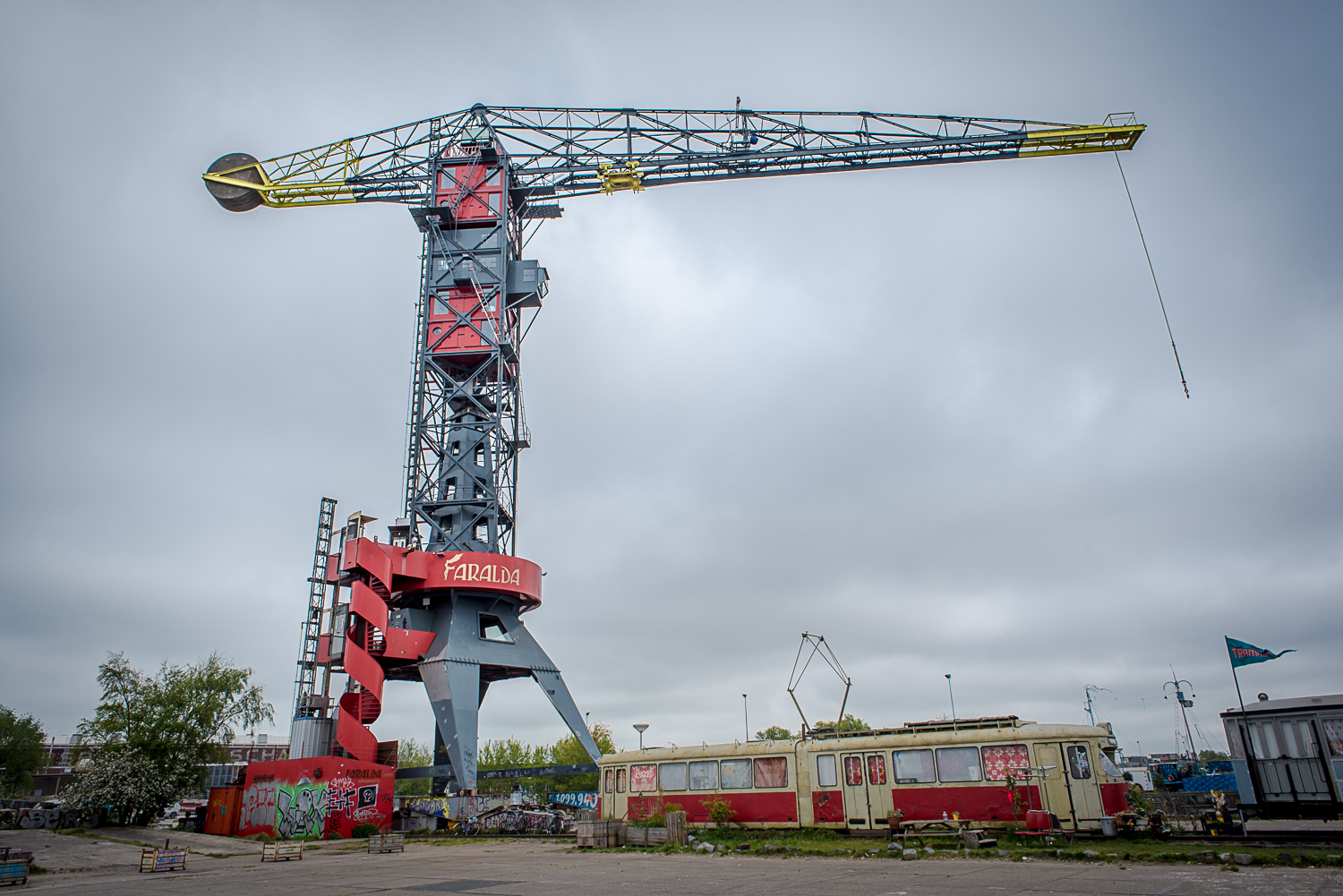 © Ayash Basu. The Faralda hotel situated in a crane. The red cubes are super high end suites, offering probably the best views of Amsterdam. A hotel with 3 rooms situated in one of the tallest cranes in Europe, amidst rail tracks and abandoned carriages.