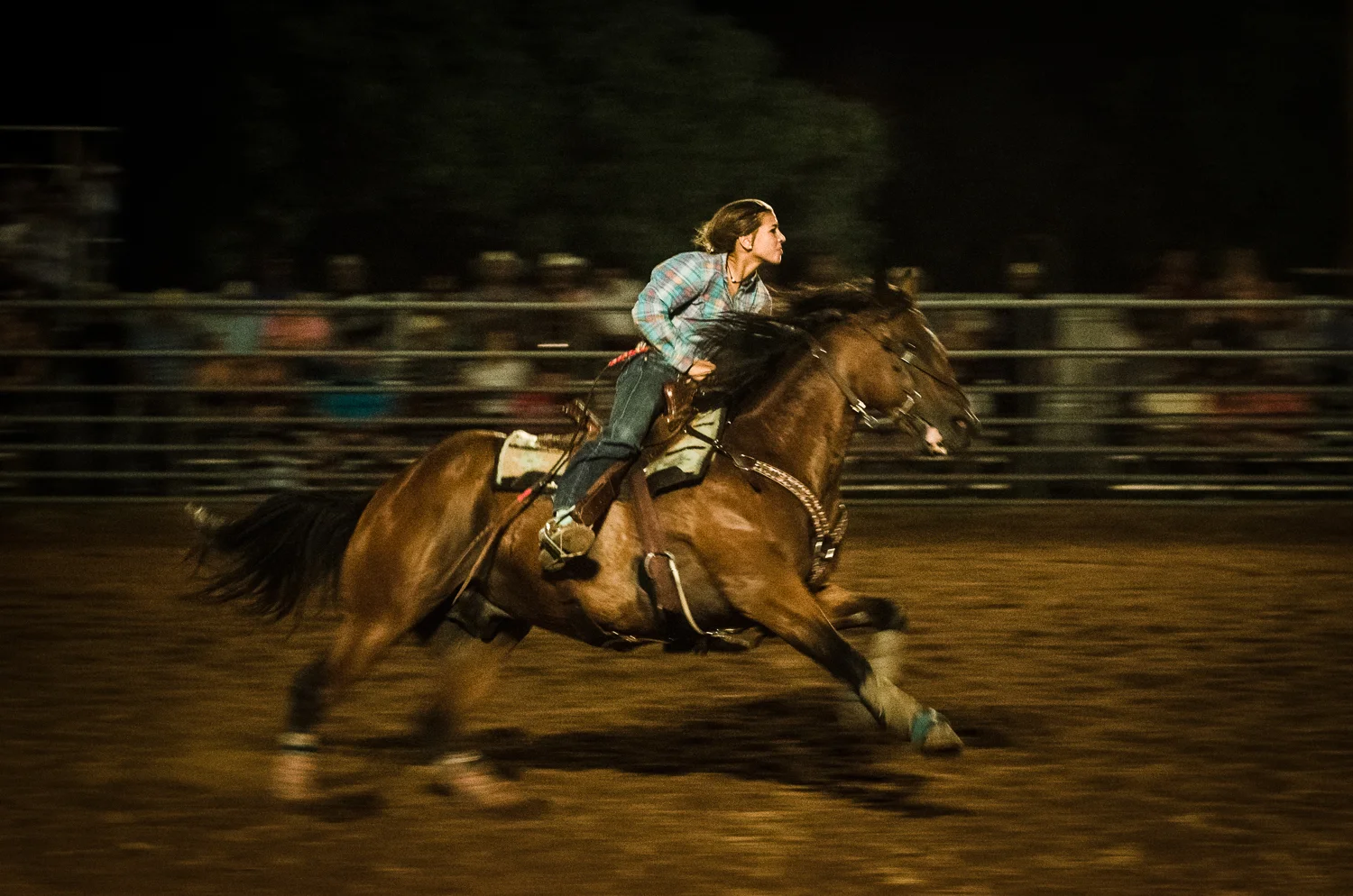 © Ayash Basu. Barrel racing is the primary competitive rodeo event for women, where a cloverleaf pattern is completed around three barrels for the fastest time. Johnson City 2017.