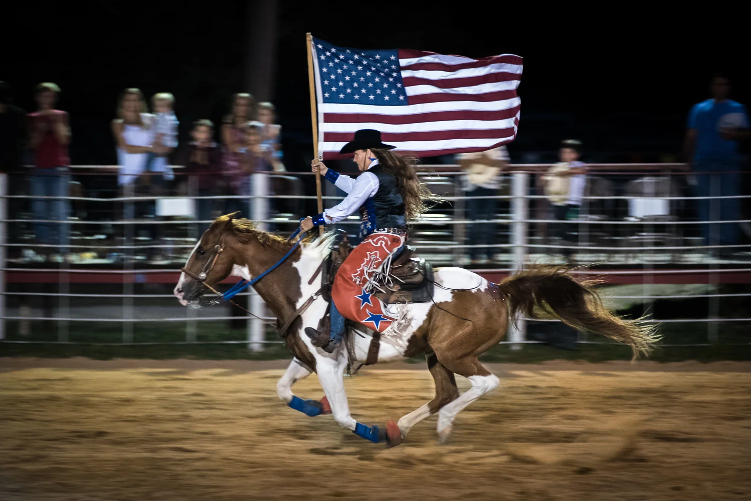 © Ayash Basu. Presenting the national flag followed by the anthem at the start of every rodeo is customary etiquette. Girls, women and horses compete for these flag spots. It's a great way to stay involved with the rodeo and continue riding without the burden of competitive events. Bandera 2017.