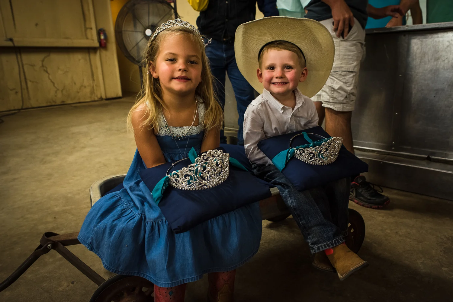 © Ayash Basu. Young kids wait side-stage for the soon to be crowned Queen of Johnson City. The entire local community, including businesses, was out there to support the contestants and everyone who participated in any way, including these crown bearers. Johnson City 2017.