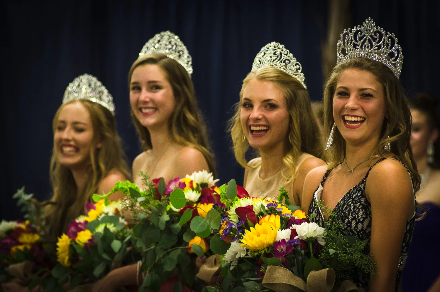 © Ayash Basu. The Queen's pageant is a big deal. The newly announced Queen (at the right) is all smiles with her runners up contestants. Her first duty after winning the crown? Clean up the trash at the rodeo the following morning. Johnson City 2017.