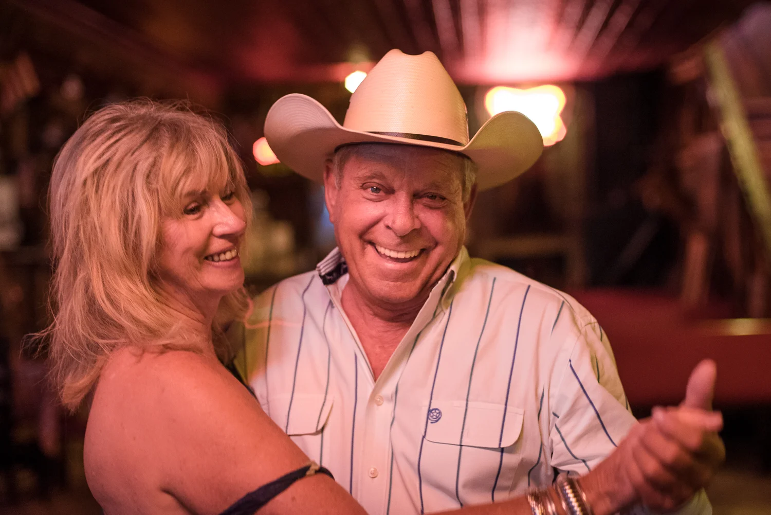 © Ayash Basu. Rodeo nights are times of celebration. Family reunions, meeting friends, open air barbecue dinners, honky-tonk sessions, late night revelry and an early morning all-you-can-eat cowboy breakfast all follow the events in the arena. Bandera 2017.