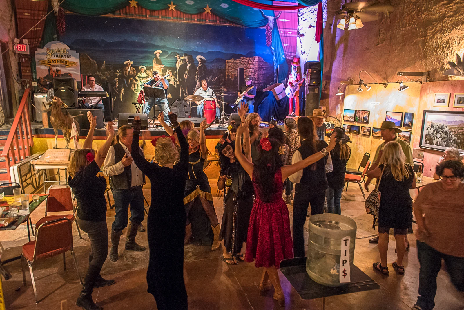 © Ayash Basu. After sundown and potluck at the cemetery, the action shifts to the Starlight Theater, where a local band and enthusiastic patrons keep the dance floor alive.
