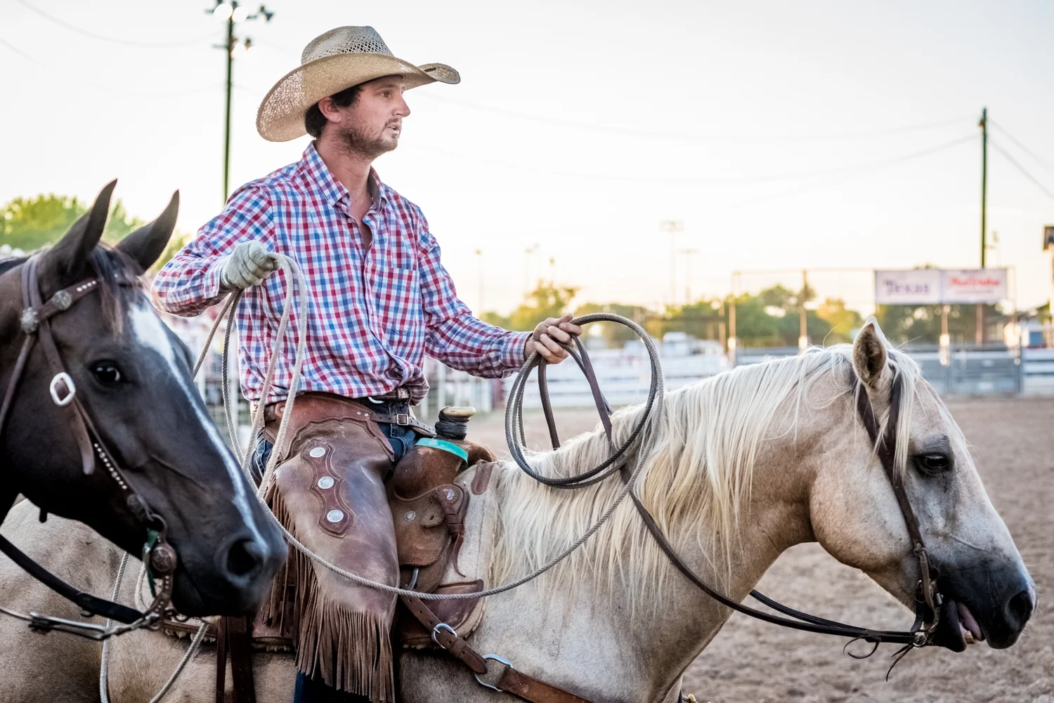 © Ayash Basu. A rancher getting ready for a night at the rodeo. It's a combination of skills, timing and some luck for a team to take home a healthy wad of cash. Bandera 2018.