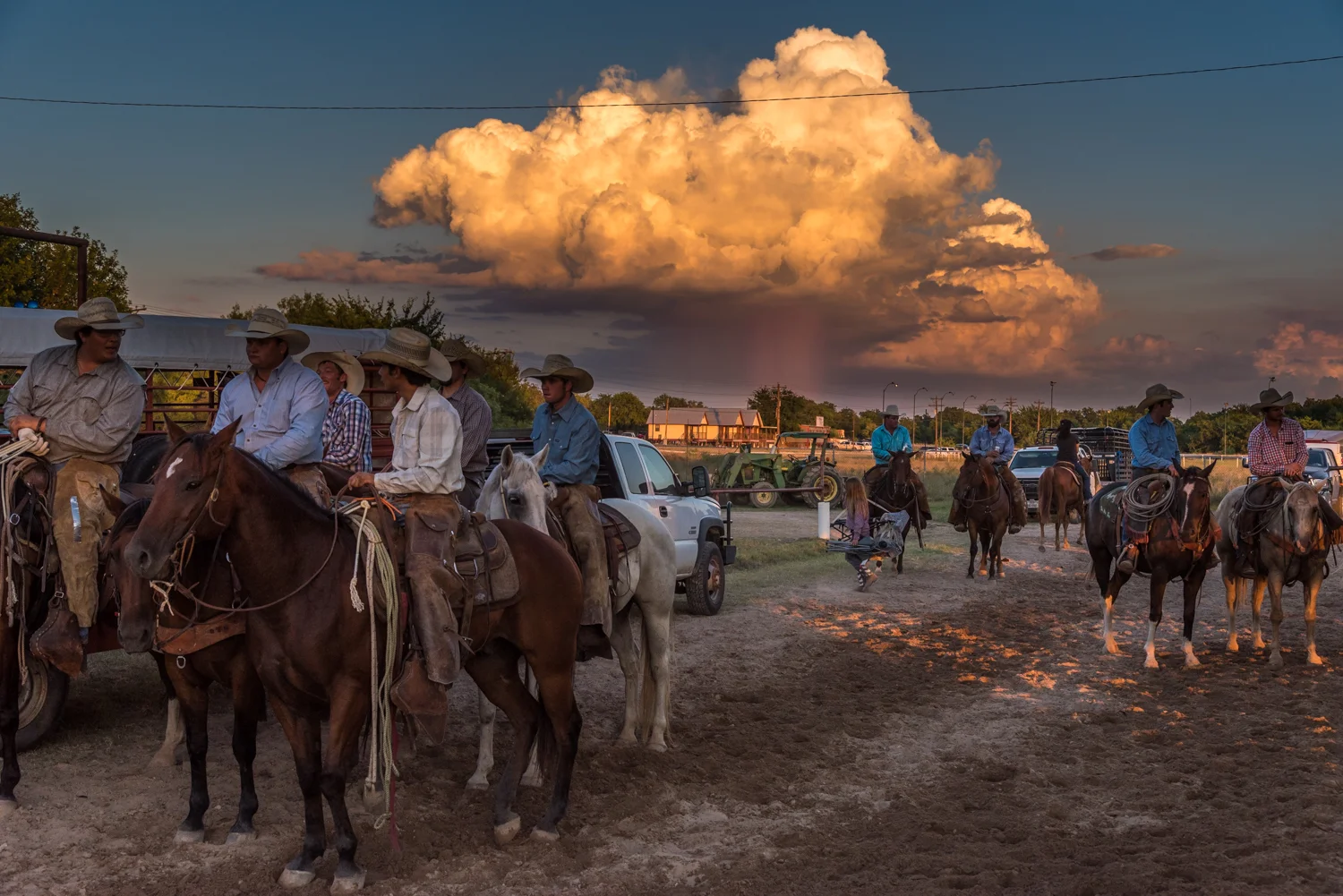 © Ayash Basu. Rodeo arena perimeters round up as perfect socializing grounds for rodeo men who share beers and catch up in between events. Bandera 2018.
