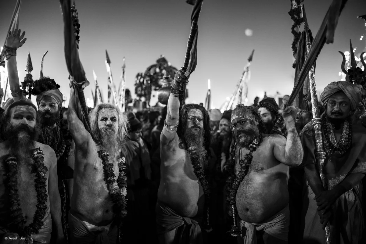 © Ayash Basu. Fourteen akharas are formally invited to the Kumbh but only six bathing processions are allowed. Consequently, smaller akharas often march behind or team up with larger ones in historically determined pairs. Here, the Anand akhara joins forces with the influential Niranjan akhara before they embark on their royal procession.