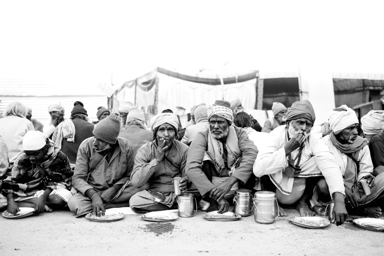 © Ayash Basu. Millions get to the Kumbh despite dire financial circumstances. For the entire duration of the Kumbh, every pilgrim is guaranteed at least two meals a day from akharas, volunteers, and other public service groups. For many, the Kumbh is the only time when they don’t have to worry about getting fed.