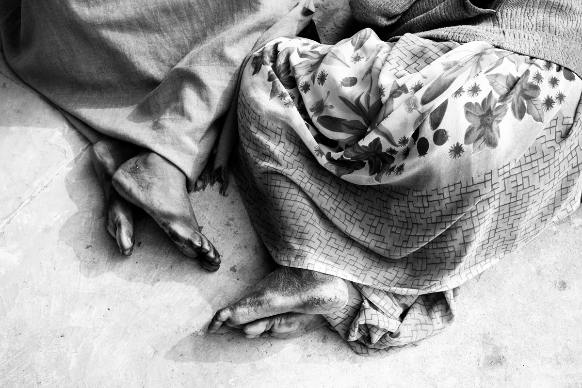 © Ayash Basu. Weary feet at rest. I was at the Kumbh for 6 days with no pilgrimage intentions and still ended up walking 120K steps over 42 miles according to my iPhone’s Health app. That’s an average of 20K steps and 7 miles a day. These feet have done way more than that for much longer, without proper footwear - only to realize a belief and a desire for a dip in the holy waters of the Sangam.
