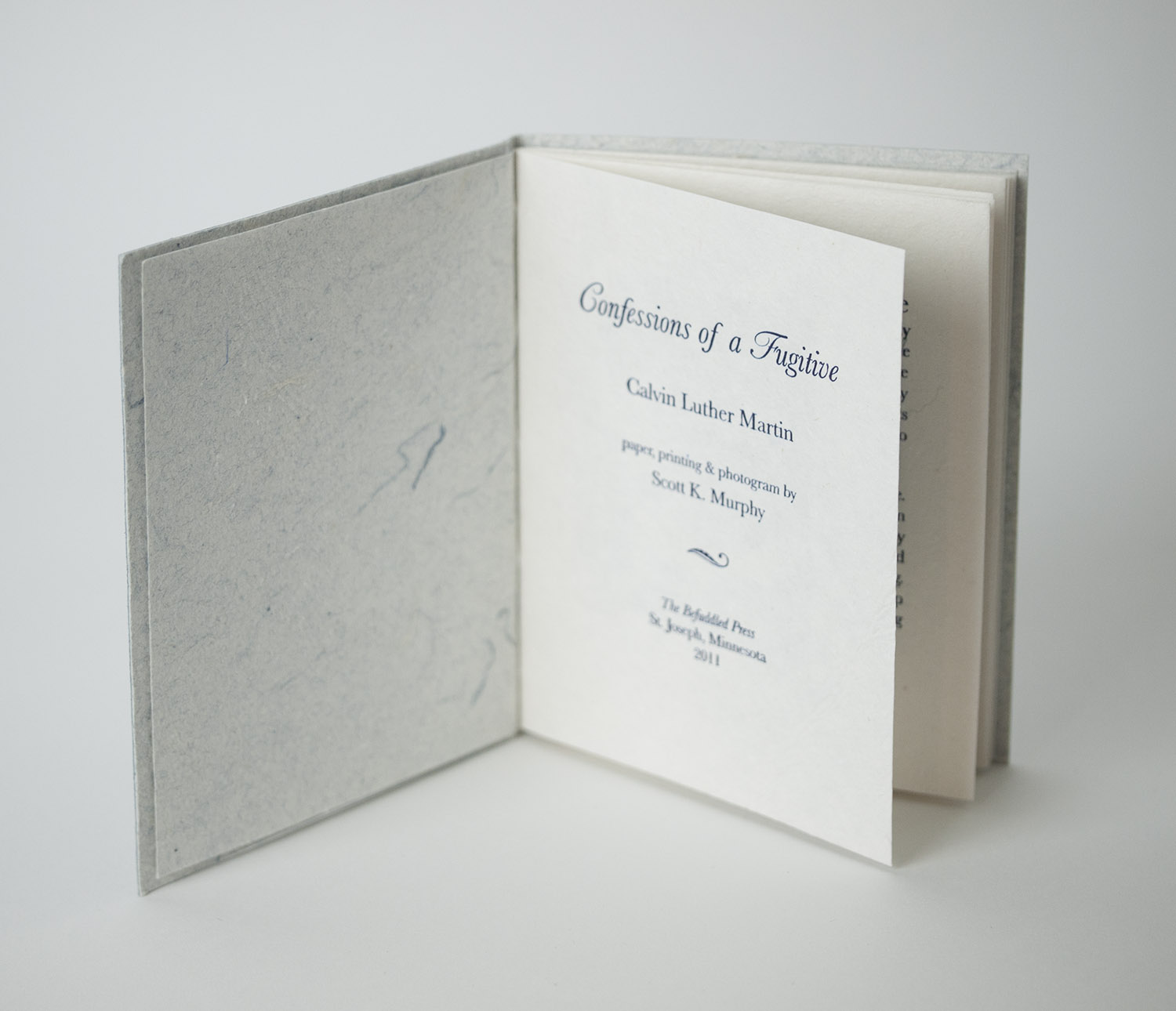 The printing is letterpress and a handmade cyanotype photogram is tipped into each book.
