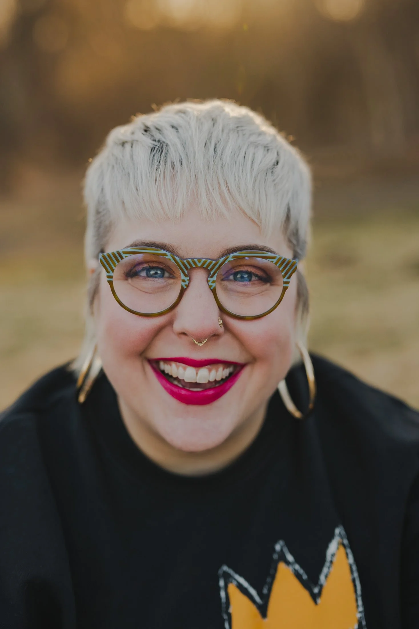 Amanda smiling with glasses on