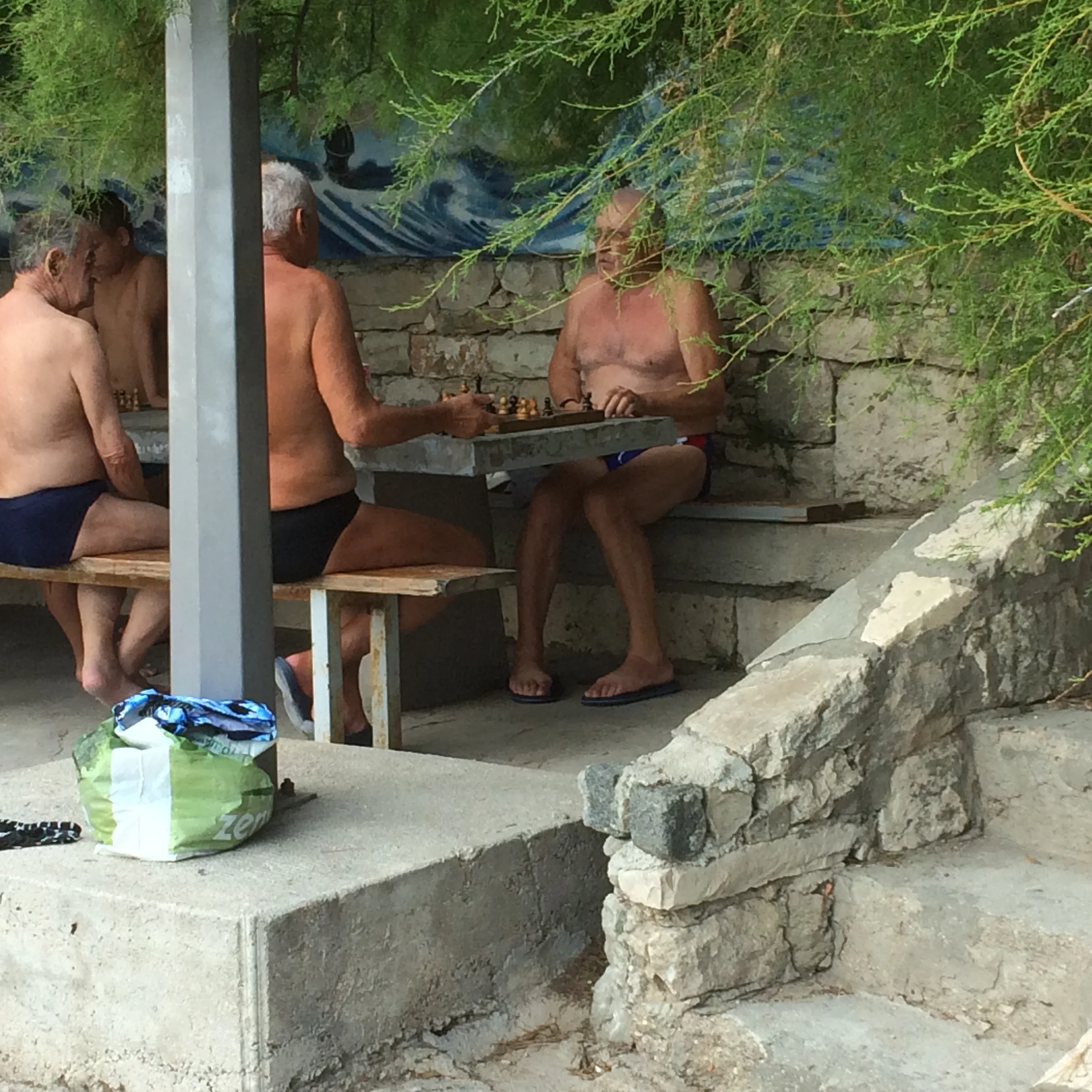 One is left to assume that the plastic bag in the foreground contains the rest of their clothes.