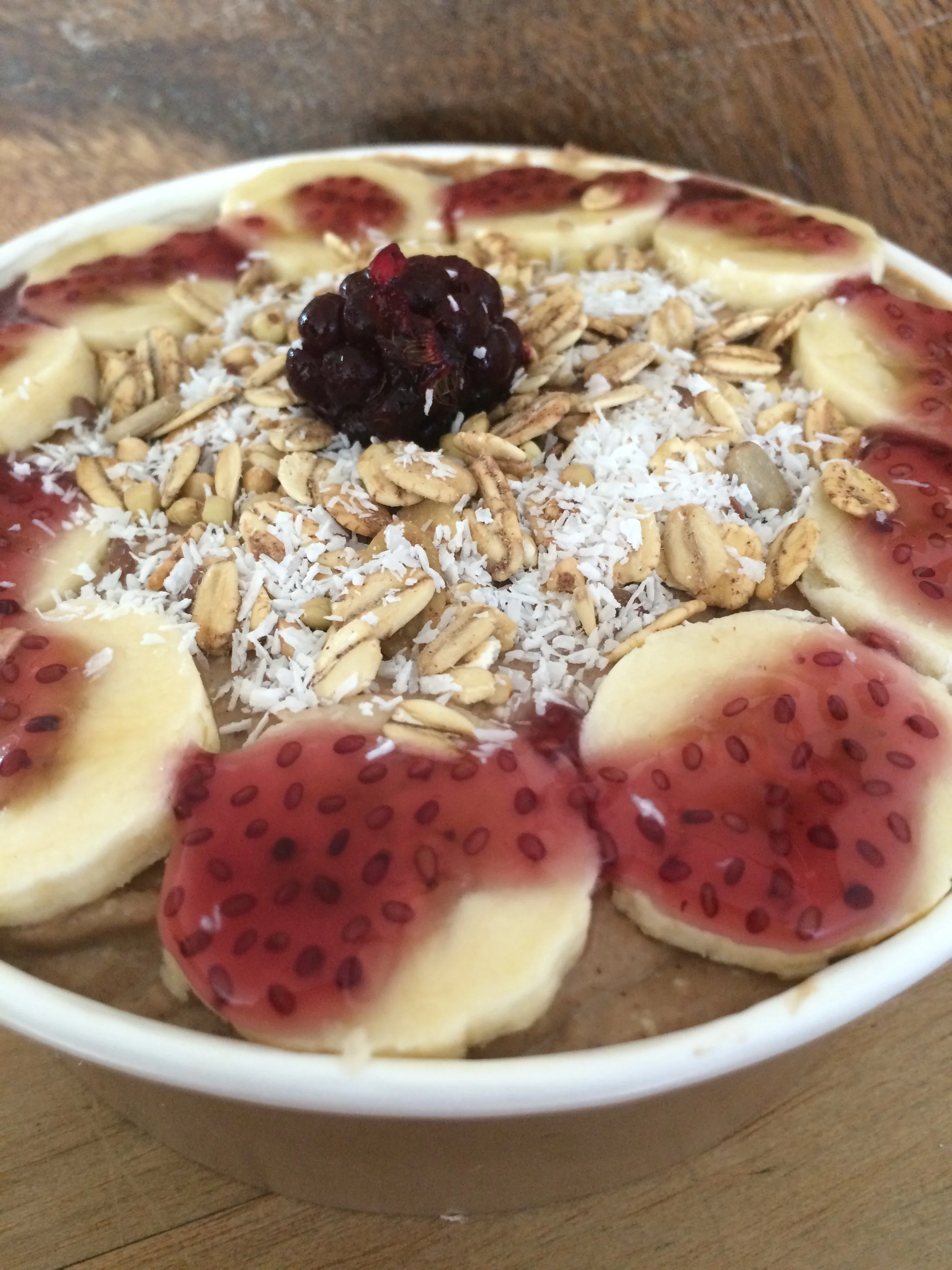 Our cacao bowl topped with a blueberry and apple chia jelly sauce