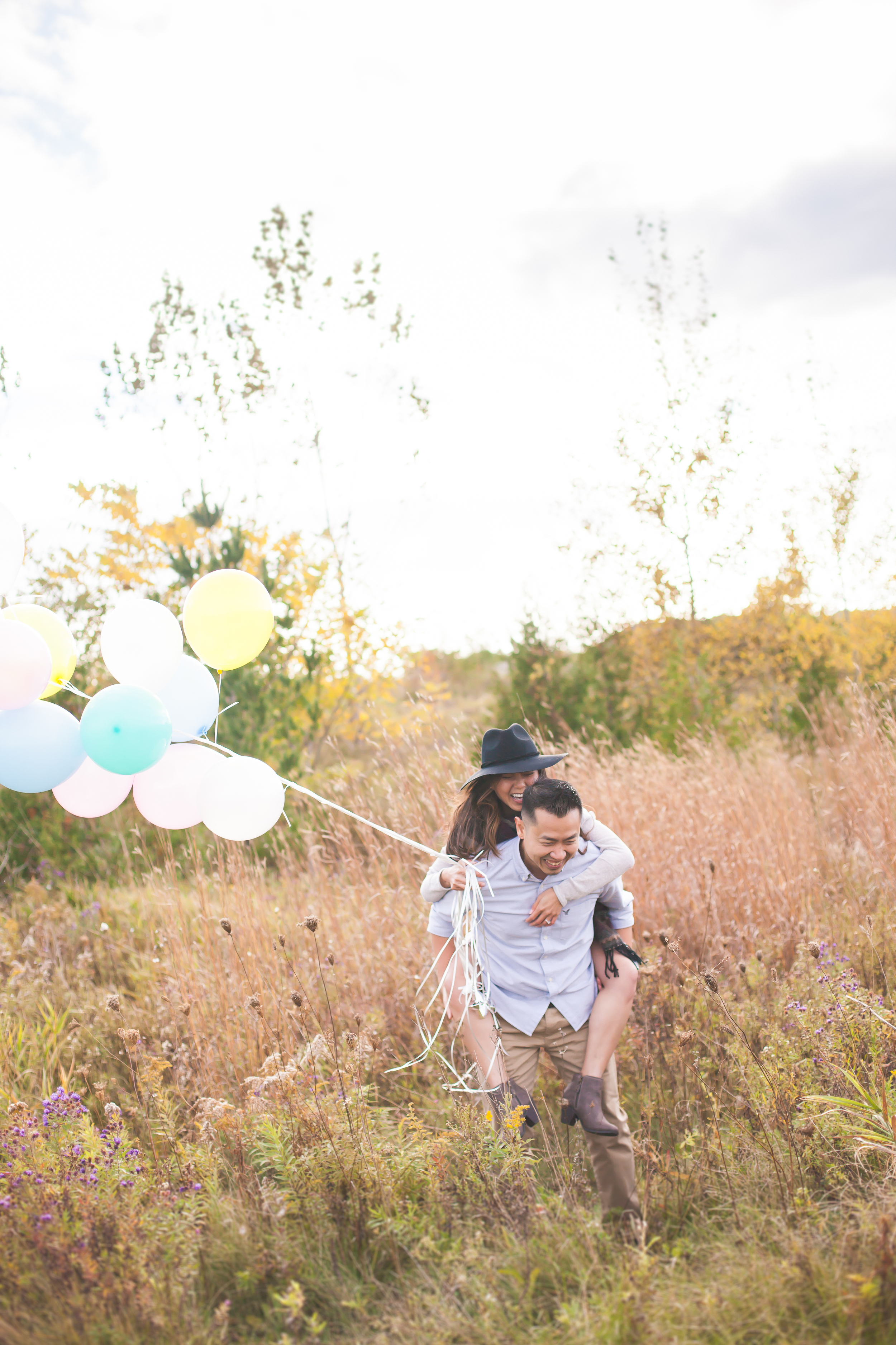 Outdoor bohemian style engagement session with balloons