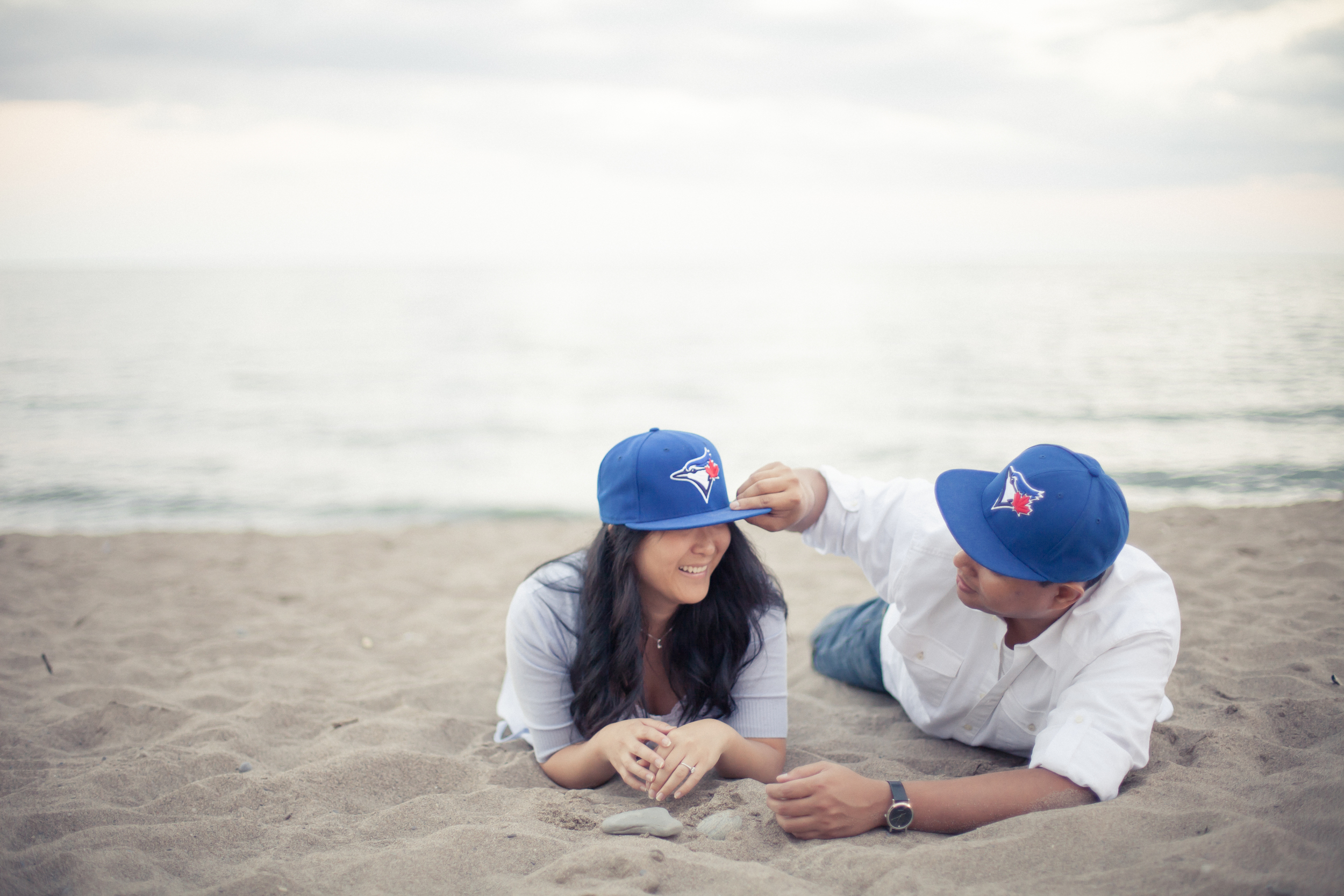 Cherry Beach engagement session with Blue Jays hats